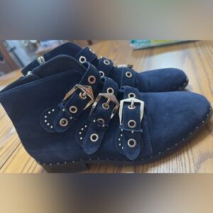 Leather: Goatskin · Suede · Polished, gold-tone grommets and hardware